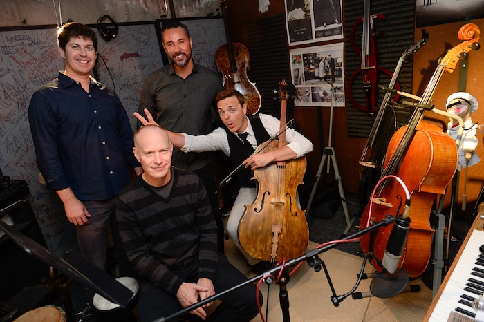 (Francisco Kjolseth | The Salt Lake Tribune) Always having fun, The Piano Guys gather in their home studio in Sandy recently as they get ready for an upcoming show. Clockwise from left, videographer Paul Anderson, music producer Al van der Beek, cellist Steven Sharp Nelson and pianist Jon Schmidt maintain a close bond and are always quick with a tease or a joke while making music.
