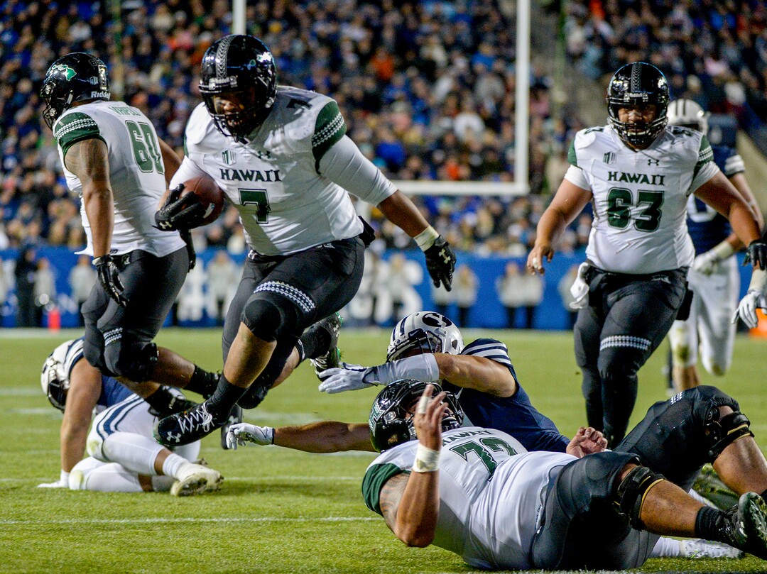 Leah Hogsten  |  The Salt Lake Tribune  Hawaii running back Dayton Furuta (7) runs for a touchdown as Brigham Young University hosts Hawaii at Lavell Edwards Stadium in Provo, Saturday Oct. 13, 2018. BYU defeated Hawaii 49-23.