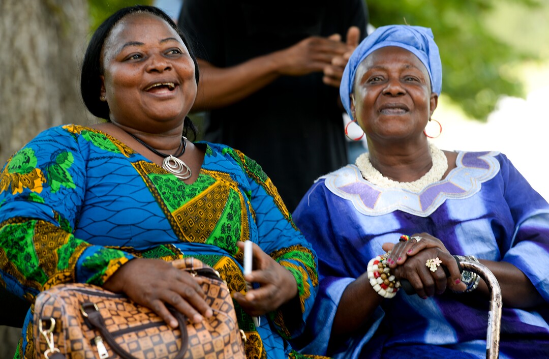 (Leah Hogsten  |  The Salt Lake Tribune)  From left: Florance Garley and her sister Biendu Kamara cheer for Garley's twin daughters as they dance during the 4th Annual African Festival sponsored by the United Africans of Utah, Saturday, July 27, 2019 at Liberty Park. The African Festival promotes African tradition, culture and heritage through the arts, food fashion, music and dance.