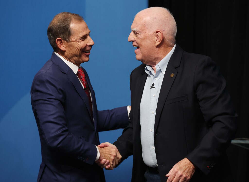 (Jeffrey D. Allred | Pool) Rep. John Curtis, R-Utah, and Glenn Wright shake hands after debating in 3rd Congressional District debate at KBYU Broadcasting building in Provo on Thursday, Oct. 6, 2022. 