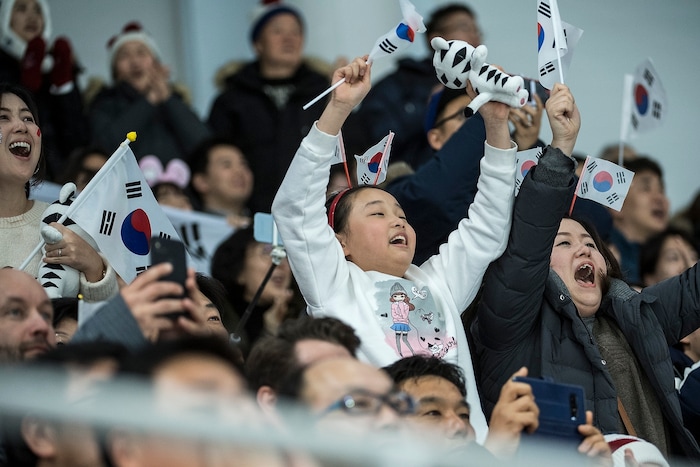 (Chris Detrick  |  The Salt Lake Tribune)  Japanese fans cheer as Nao Kodaira races in the Ladies' 500m at the Gangneung Oval during the Pyeongchang 2018 Winter Olympics Sunday, Feb. 18, 2018. Kodaira won the event with a time of 36.94.
