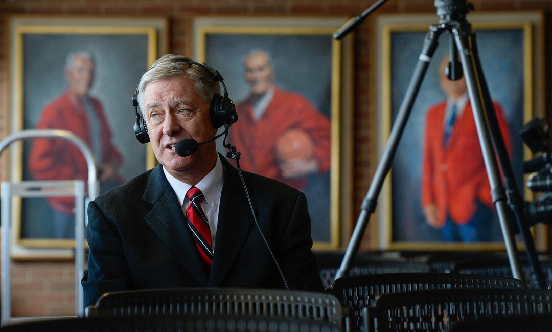 (Francisco Kjolseth  |  The Salt Lake Tribune)  University of Utah Athletics Director Chris Hill does a radio interview following after announcing his plan to retire this spring after 31years. In background are former athletic directors and coaches on display at the Jon M. Huntsman Center on campus on Monday, March 26, 2018. Hill is the longest actively tenured athletics director at the same school in the NCAA FBS.