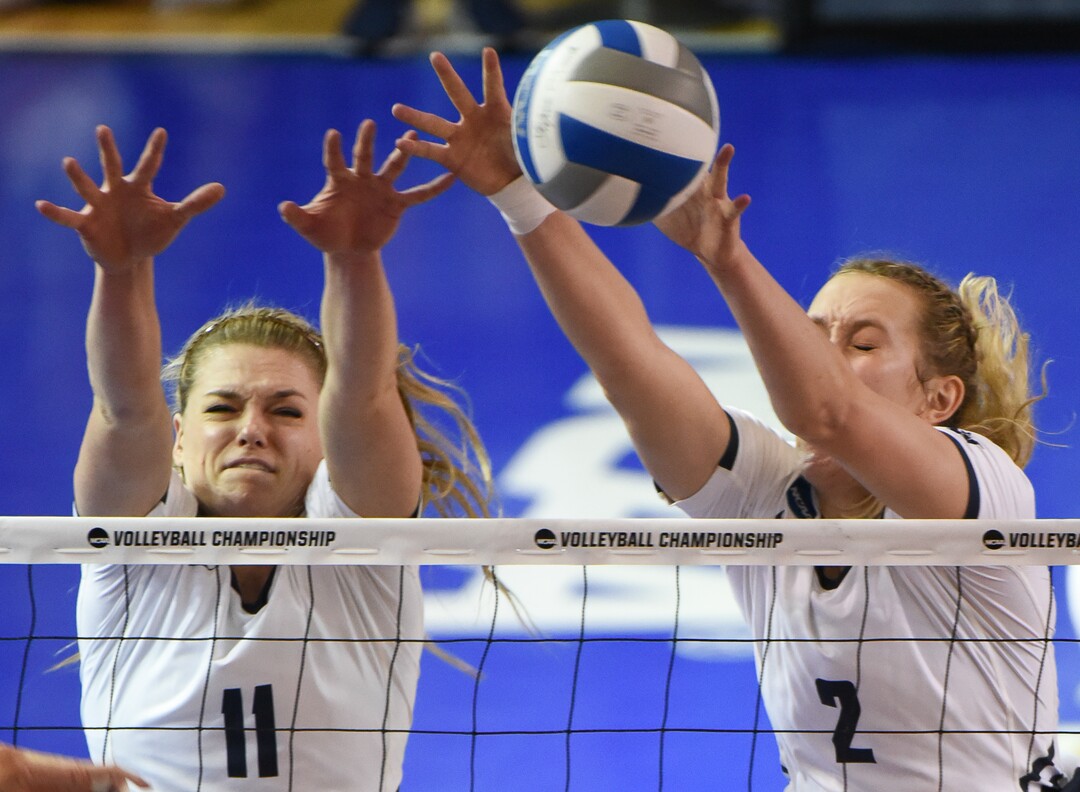 (Francisco Kjolseth  |  The Salt Lake Tribune)  BYU's Lacy Haddock (11) and Heather Gneiting (2) try to block a shot by Florida in their NCAA Tournament Round of 16 match at Smith Fieldhouse, Friday, Dec. 7, 2018.