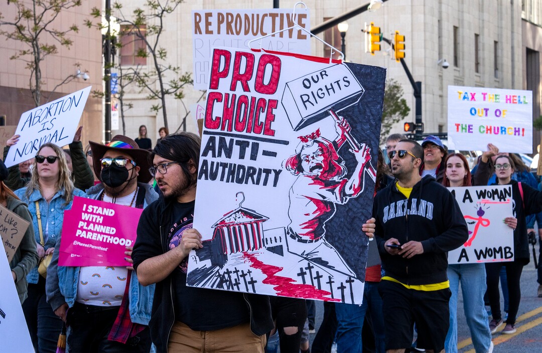 (Rick Egan | The Salt Lake Tribune) Hundreds of protesters march down State Street after a bans off our bodies protest hosted by Planned Parenthood, on Tuesday, May 3, 2022.