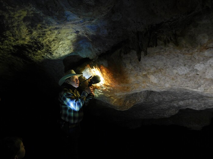 Erin Alberty  |  The Salt Lake TribuneJerald Bates holds his flashlight up to show the translucent calcite formations in Crystal Ball Cave during a tour Feb. 20, 2017 in Gandy, Utah.