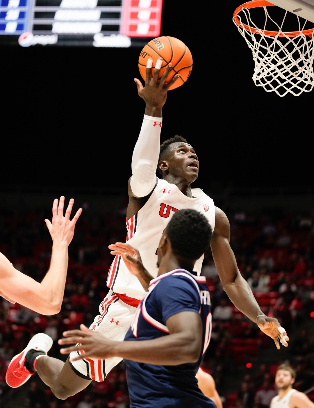 (Francisco Kjolseth | The Salt Lake Tribune) Utah Utes center Keba Keita (13) sails one in as the University of Utah hosts the Arizona Wildcats in NCAA basketball in Salt Lake City on Thursday, Dec. 1, 2022.