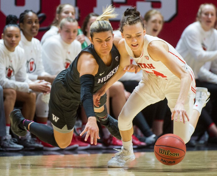 (Rick Egan  |  The Salt Lake Tribune)       Washington Huskies guard Amber Melgoza (4) goes for a loose ball along with Utah Utes guard/forward Tilar Clark (24), in PAC-12 women's basketball action at the Jon M. Huntsman Center, Sunday, Feb. 18, 2018.