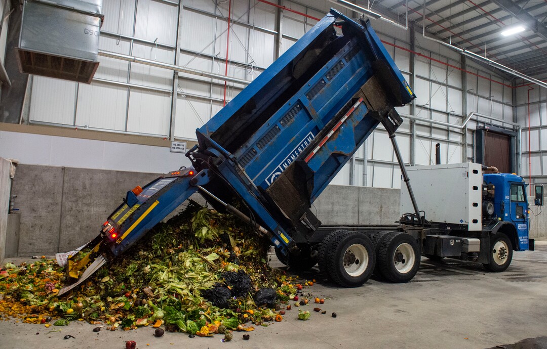 (Rick Egan  |  The Salt Lake Tribune)    A truck from Momentum recycling dumps a load of food waste at Wasatch Resource Recovery in North Salt Lake.  Friday, May 24, 2019.
