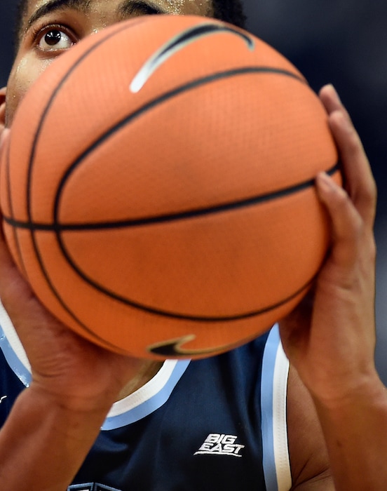 The Big East logo is seen on the shirt of Villanova's Phil Booth as he shoots a free throw during the first half of an NCAA college basketball game against Connecticut, Saturday, Jan. 20, 2018, in Hartford, Conn. (AP Photo/Jessica Hill)