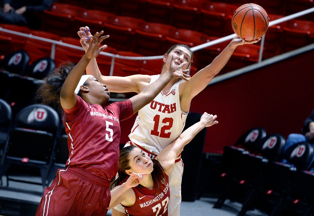 Scott Sommerdorf   |  The Salt Lake Tribune  Utah Utes forward Emily Potter (12) reaches for a rebound while sandwiched between Washington State Cougars forward Kayla Washington (5) and Washington State Cougars guard Pinelopi Pavlopoulou (22) during first half play. Washington State led Utah 27-22 at the half, Sunday, February 5, 2017. 