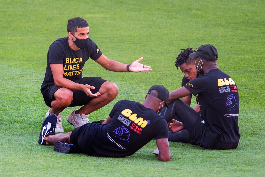 (Rick Egan  |  The Salt Lake Tribune)     Players mingle on the field wearing Black Lives Matter shirts, in the empty stadium as the game between Real Salt Lake and LAFC was postponed after teams in sports leagues across the country boycotted scheduled games to protest the police shooting of Jacob Blake, RSL and LAFC followed suit, along with the rest of MLS, on Wednesday, Aug. 26, 2020.