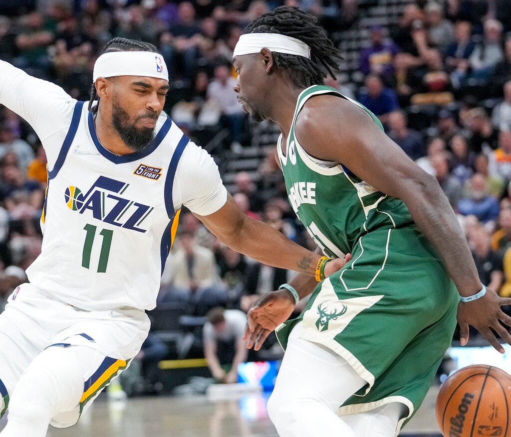 (Leah Hogsten | The Salt Lake Tribune) Utah Jazz guard Mike Conley (11) pressures Milwaukee Bucks guard Jrue Holiday (21)as the Utah Jazz host the Milwaukee Bucks at Vivint Arena, Mar. 14, 2022.