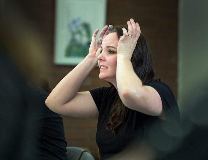 (Leah Hogsten  |  The Salt Lake Tribune) Jules Challis shows her frustrations with the speed and effortlessness that former television star painter Bob Ross shares as she tries to follow along with the video during  Bob Ross Paint-Along class, Saturday, January 6, 2018 at the Salt Lake City Public Library's Sweet Branch in the Avenues. 