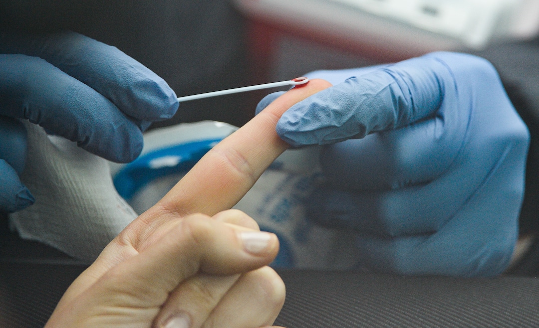 (Francisco Kjolseth  |  The Salt Lake Tribune) A small drop of blood is drawn by a registered nurse as people line up in their cars for COVID-19 antibody testing at the Galena Hills Park in Draper on Wednesday, May 20, 2020.