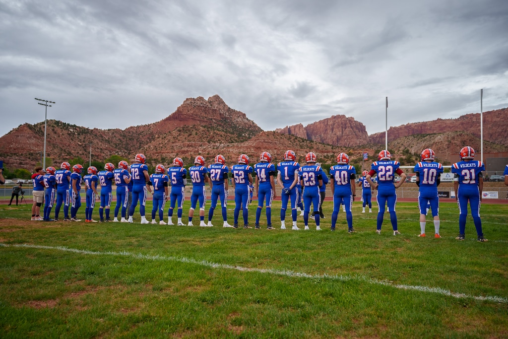 (Trent Nelson | The Salt Lake Tribune) Water Canyon High School football players prepare for their school's first football game in Hildale on Friday, Aug. 12, 2022. Sports were banned in the former polygamous community of Fundamentalist Latter-Day Saints, but now a changed town is embracing new traditions.