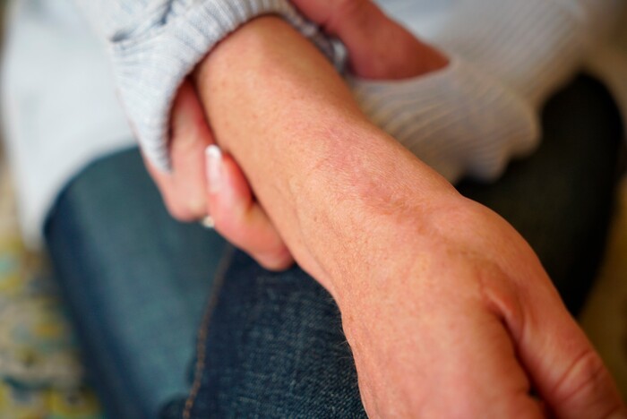 In this Wednesday, March 27, 2019, photo, Kacey Ruegsegger Johnson shows her scars during an interview at her home in Cary, N.C. Ruegsegger Johnson survived a shotgun blast during the 1999 shootings at Colorado's Columbine High School that left 12 students, one teacher, and both gunmen dead. (AP Photo/Allen G. Breed)