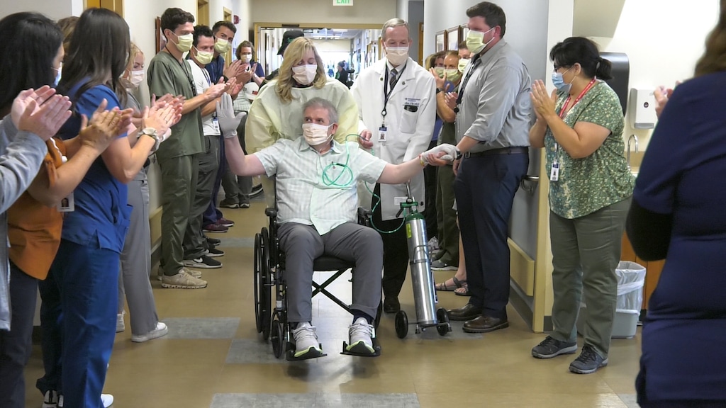 (Intermountain Healthcare) Thomas Kearl, in wheelchair, leaves Intermountain Medical Center Aug. 24, 2021, after spending 223 days in the hospital while sick with COVID-19. Kearl requested that Kenny Loggins' song "Celebrate Me Home" be played as he said farewell to the medical team that cared for him.