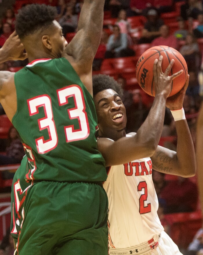 (Rick Egan  |  The Salt Lake Tribune)  Utah Utes guard Kolbe Caldwell (2) tries to get to the basket, as Mississippi Valley State Delta Devils center Jamal Watson (33) defends, in basketball action Utah Utes vs. Mississippi Valley State Delta Devils, at the Jon M. Huntsman Center,  Monday, November 13, 2017.
