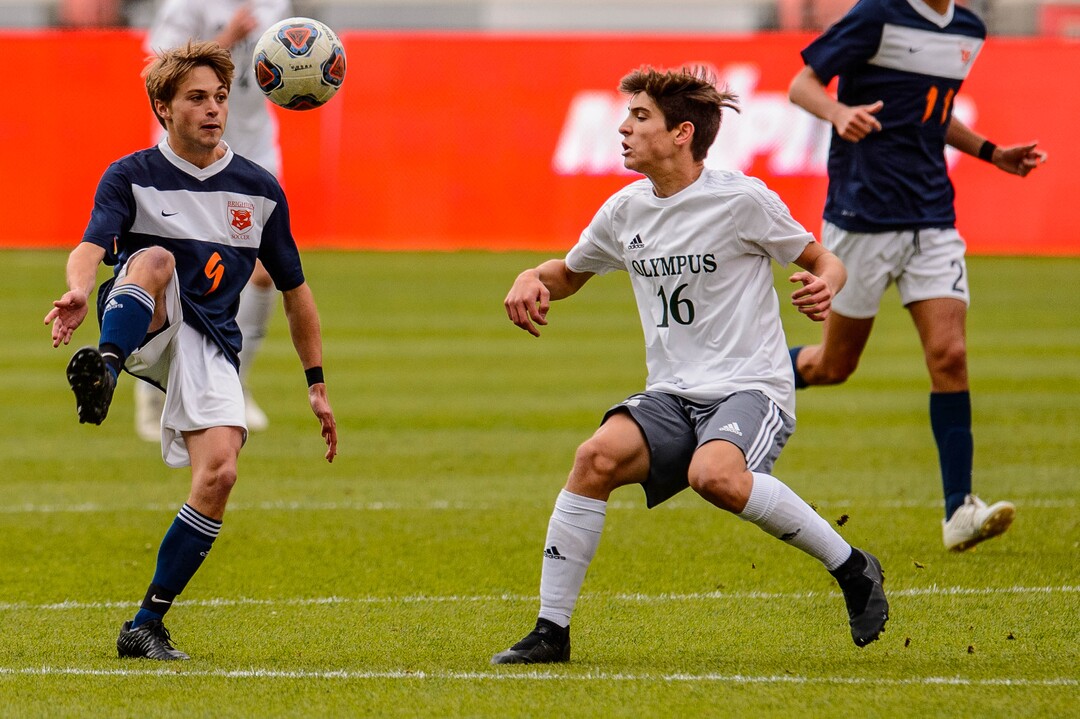 (Trent Nelson  |  The Salt Lake Tribune)  Brighton's Alex Fankhauser (9) and Olympus's Noah Johnson (16) as Olympus faces Brighton High School in the 5A boys state championship game at Rio Tinto Stadium in Sandy, Thursday May 23, 2019.