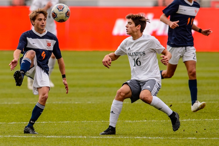 (Trent Nelson  |  The Salt Lake Tribune)  
Brighton's Alex Fankhauser (9) and Olympus's Noah Johnson (16) as Olympus faces Brighton High School in the 5A boys state championship game at Rio Tinto Stadium in Sandy, Thursday May 23, 2019.