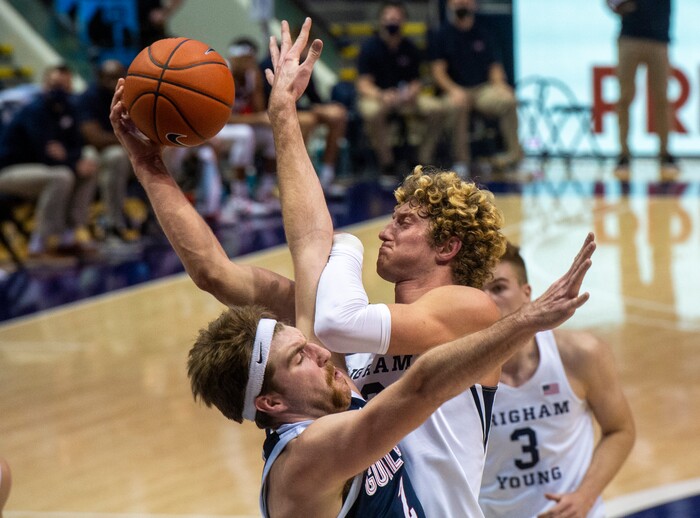 (Rick Egan | The Salt Lake Tribune)  Brigham Young Cougars forward Caleb Lohner (33) draws a foul as he collides with Gonzaga Bulldogs forward Drew Timme (2), in West Coast Conference Basketball action between the Brigham Young Cougars and the Gonzaga Bulldogs at the Marriott Center in Provo, on Monday, Feb. 8, 2021.