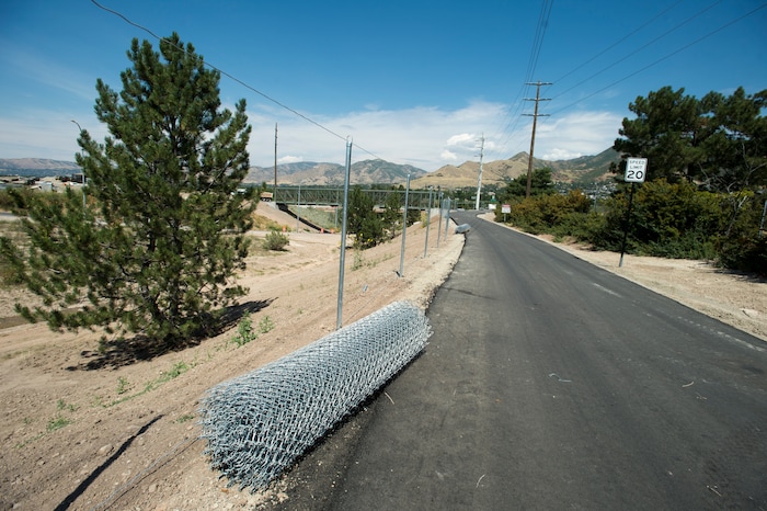 (Rick Egan | The Salt Lake Tribune) Chain-link fence waits to line the sides of a new segment of Parley's Trail, Wednesday, Aug. 30, 2017.