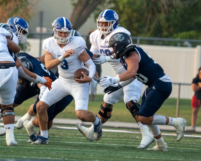 (Rick Egan | The Salt Lake Tribune) Quarterback Cody Lazenby (3), runs the ball  for Bingham, in  prep football action between the Corner Canyon Chargers and the Bingham Miners, on Friday, Aug. 27, 2021.