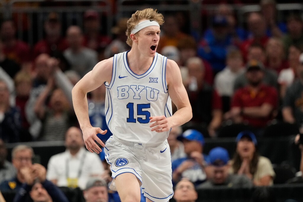 (Charlie Riedel | AP) Brigham Young's Richie Saunders (15) celebrates after scoring during the first half against Iowa State in the quarterfinal round of the Big 12 Conference tournament, Thursday, March 13, 2025, in Kansas City, Mo.