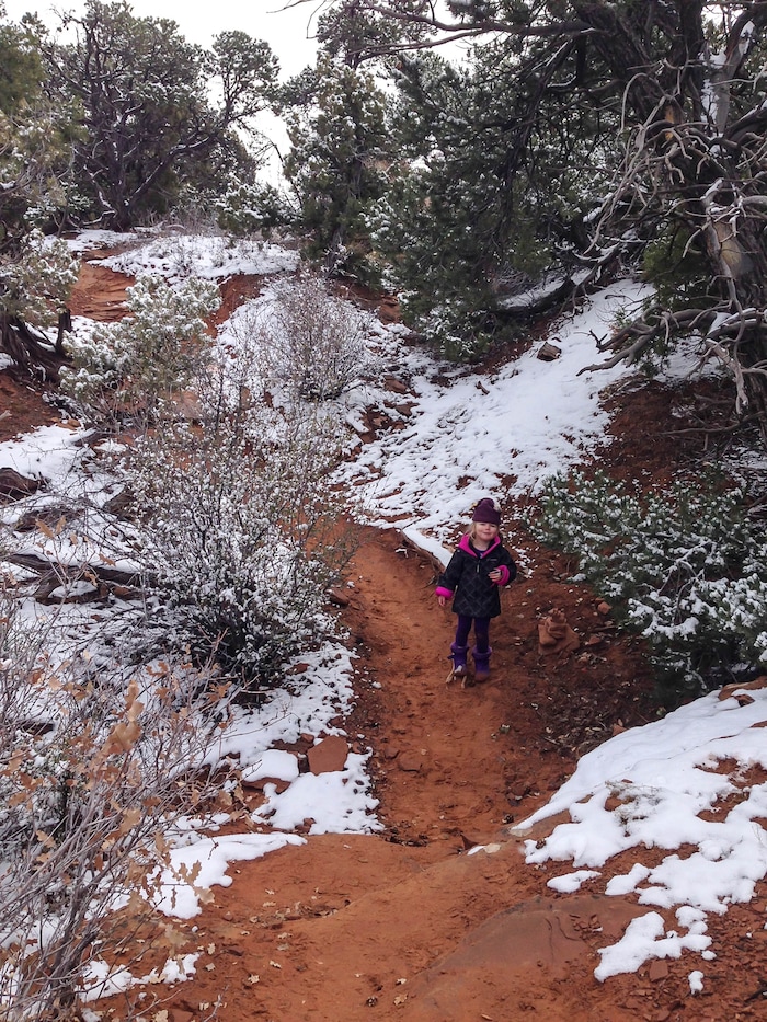 (Erin Alberty  |  The Salt Lake Tribune) 

The author's daughter makes her way through a winter wonderland Nov. 29, 2015 at Arches National Park.