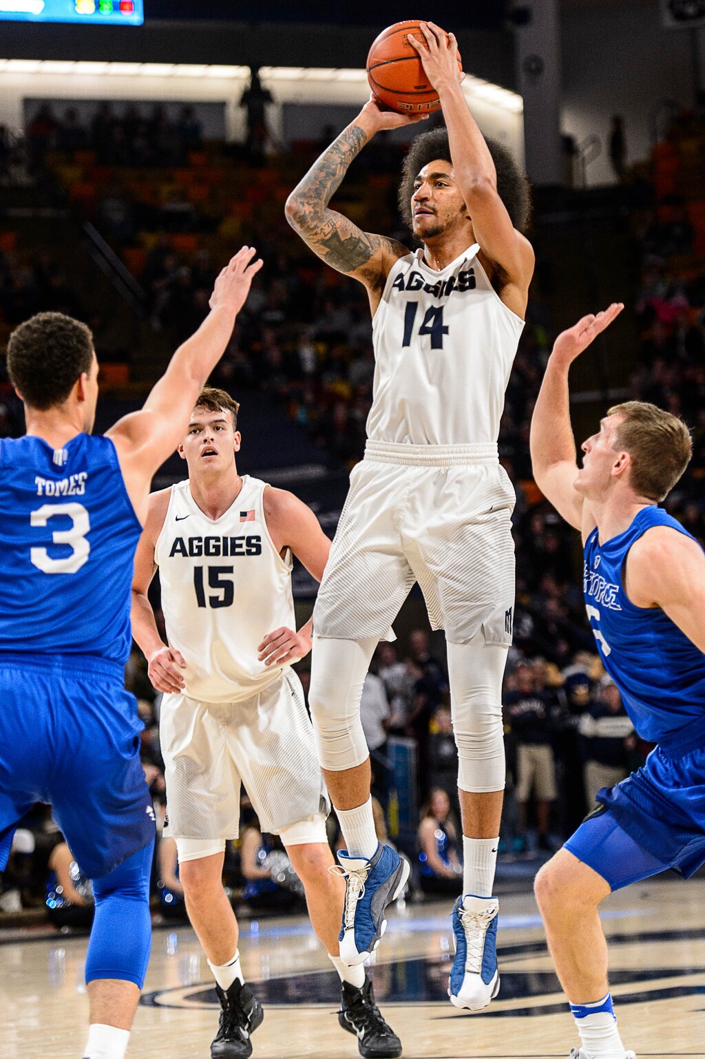 Trent Nelson  |  The Salt Lake TribuneUtah State Aggies forward Jalen Moore (14) shoots as Utah State hosts Air Force, NCAA basketball in Logan, Saturday February 25, 2017.