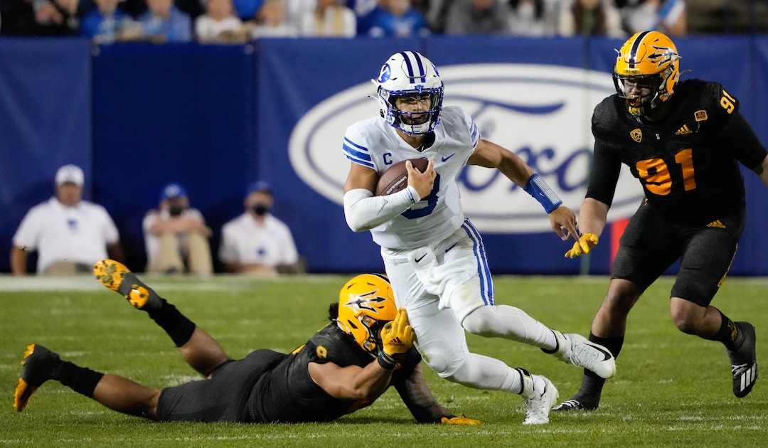 (Francisco Kjolseth | The Salt Lake Tribune) Brigham Young Cougars quarterback Jaren Hall (3) outmaneuvers the Arizona State Sun Devils defense in the 4th quarter of play at LaVell Edwards Stadium in Provo, on Saturday, Sept. 18, 2021.