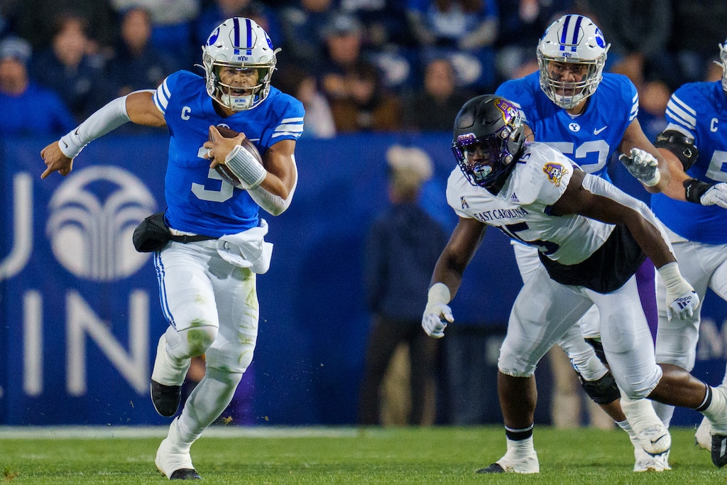(Trent Nelson | The Salt Lake Tribune) Brigham Young Cougars quarterback Jaren Hall (3) runs the ball as BYU hosts East Carolina, NCAA football in Provo on Friday, Oct. 28, 2022.