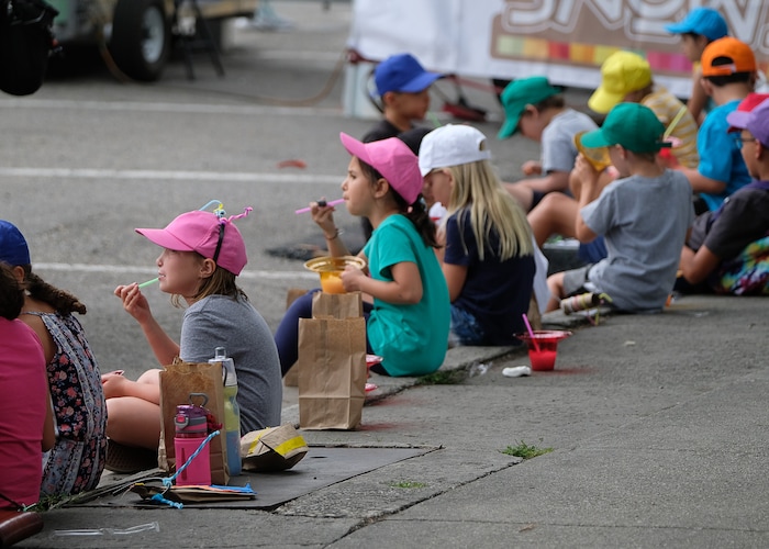 (Francisco Kjolseth  |  The Salt Lake Tribune)  Kids take a snack break during the annual 2019 Utah Arts Festival as it kicks off at Library Square and Washington Square in downtown Salt Lake City, Thursday, June 20, 2019, with visual and performance art of all varieties and food for all ages from June 20-23.
