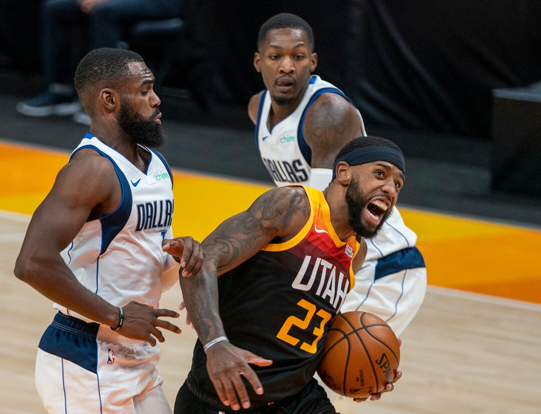 (Rick Egan | The Salt Lake Tribune) Utah Jazz forward Royce O'Neale (23) takes the ball to the hoop, as Dallas Mavericks forward Tim Hardaway Jr. (11) and Dallas Mavericks guard Josh Richardson (0) defend, in NBA action between the Utah Jazz and the Dallas Mavericks at Vivint Arena, on Friday, Jan. 29, 2021.