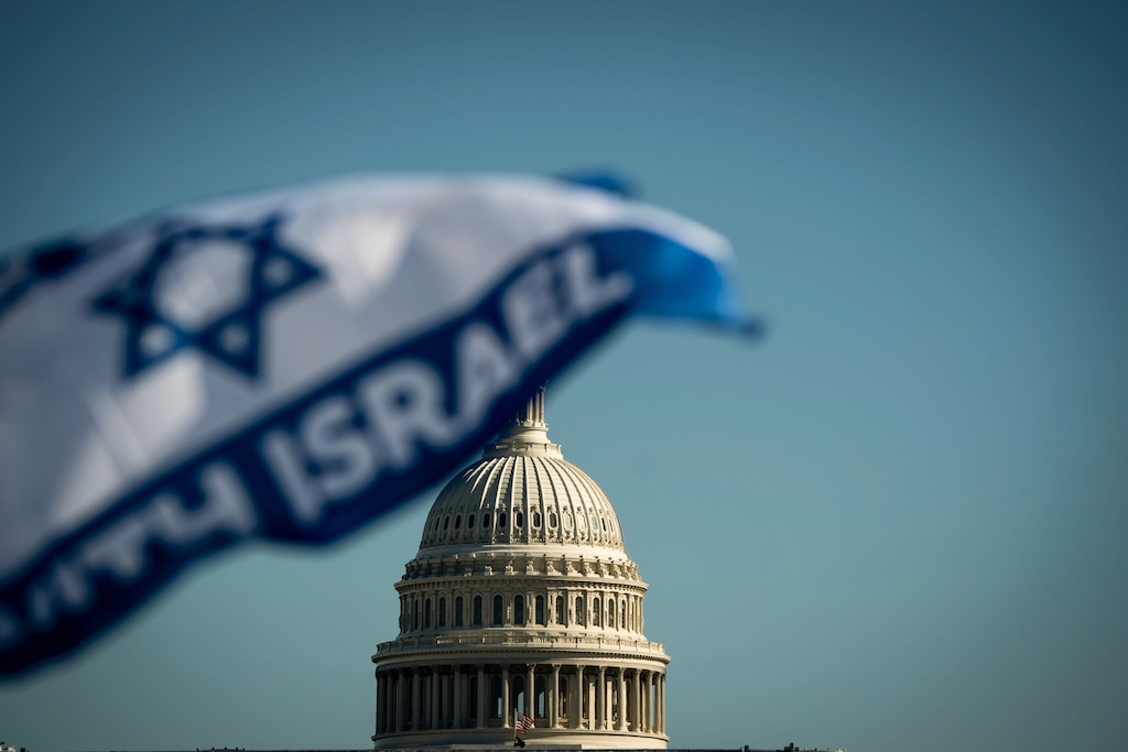 (Haiyun Jiang | The New York Times) The U.S. Capitol in Washington, as protestors gather for a pro-Israel march on Nov. 14, 2023.