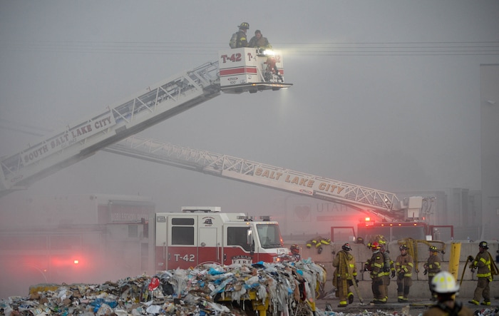 (Francisco Kjolseth  |  The Salt Lake Tribune) Fire crews respond to a fire at Rocky Mountain Recycling South Salt Lake on Saturday, July 11, 2020.