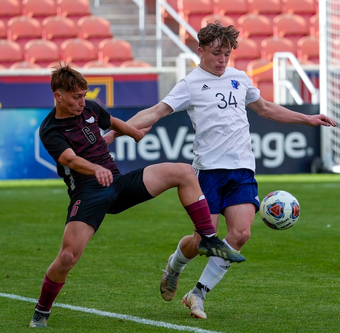 (Leah Hogsten | The Salt Lake Tribune) Layton's Marcelo Morais battles Real's Hunter Jenkins as Real Salt Lake Academy meets Layton Christian Academy for the 3A State Soccer Championship title at Rio Tinto Stadium, Wednesday, May 11, 2022. Layton Christian Academy won the title 4-0. 