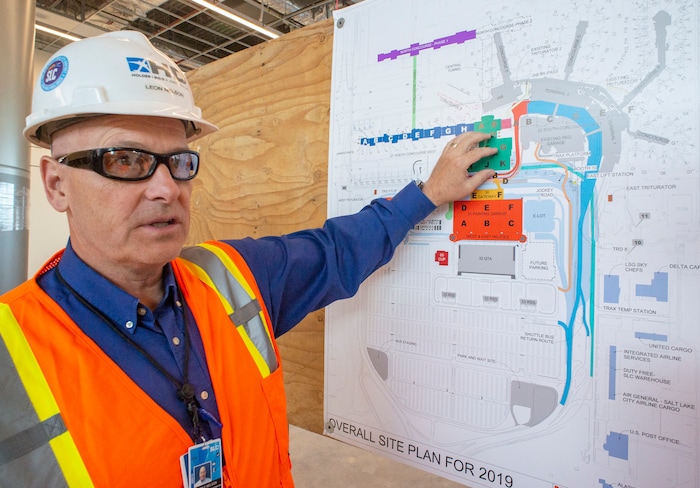 (Rick Egan  |  The Salt Lake Tribune)       Leon Nelson construction director, points out some highlights of the new concourse. In less than a year the Salt Lake City Department of Airports will open the first phase of the new Salt Lake International Airport, Monday, Sept. 23, 2019.