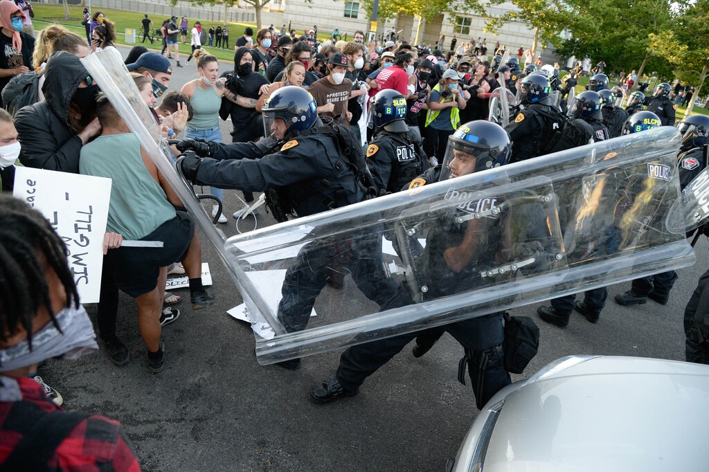 (Francisco Kjolseth  |  The Salt Lake Tribune) Police engage with protesters reacting to the announced ruling by Salt Lake County District Attorney Sim Gill on Thursday, July 9, 2020, that the shooting death of 22-year-old Bernardo Palacios-Carbajal in May by police officers was legally justified.