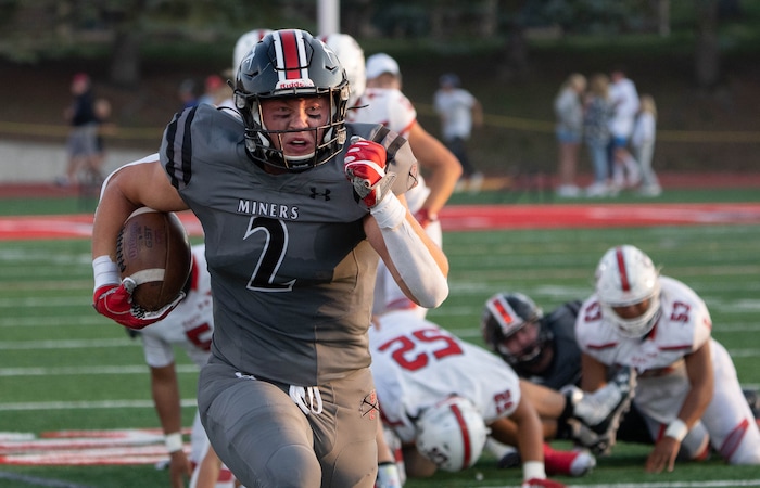 (Francisco Kjolseth | The Salt Lake Tribune) Carson Tabaracci (2) eyes the end zone In prep football action between Park City Miners and the East Leopards on Friday, Sept. 3, 2021.