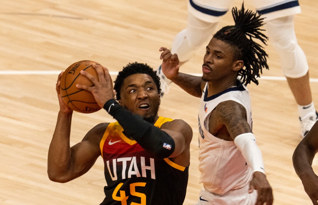 (Rick Egan | The Salt Lake Tribune) Utah Jazz guard Donovan Mitchell (45) gets by Memphis Grizzlies guard Ja Morant (12) to score, in game 2 of NBA Playoffs at Vivint Arena, on Wednesday, May 26, 2021.
