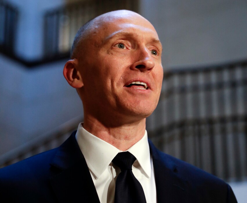 In this Nov. 2, 2017, file photo, Carter Page speaks with reporters following a day of questions from the House Intelligence Committee on Capitol Hill in Washington. A new congressional memo alleging FBI surveillance abuse is being used to undermine the legitimacy of special counsel Robert Mueller’s Russia investigation. But included in the four-page document are revelations that might complicate the effort. (AP Photo/J. Scott Applewhite)
