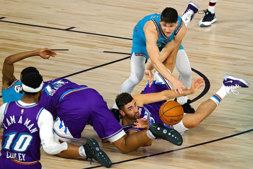 (Kevin C. Cox | Pool via AP) Utah Jazz's Georges Niang (31) grabs a loose ball in front of Memphis Grizzlies' Grayson Allen (3) and De'Anthony Melton (0) during the second half of an NBA basketball game Wednesday, Aug. 5, 2020, in Lake Buena Vista, Fla.