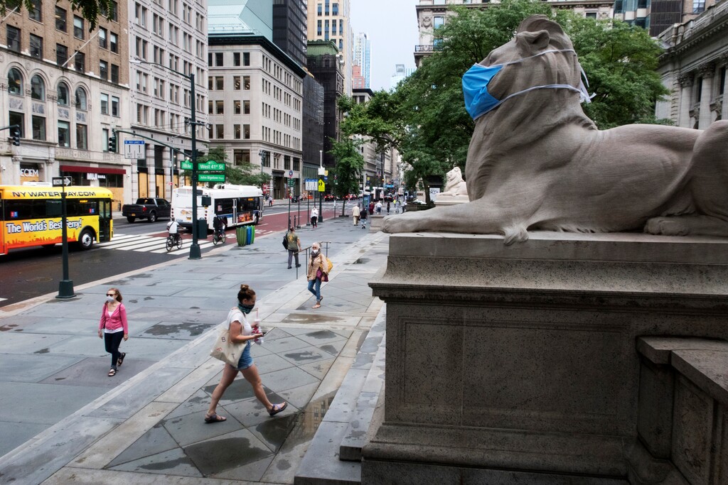 (Ted Shaffrey | AP file photo)  A face mask covers the mouth and nose of one of the iconic lion statues in front of the New York Public Library Main Branch on Wednesday, July 1, 2020, in New York, amid the coronavirus pandemic.