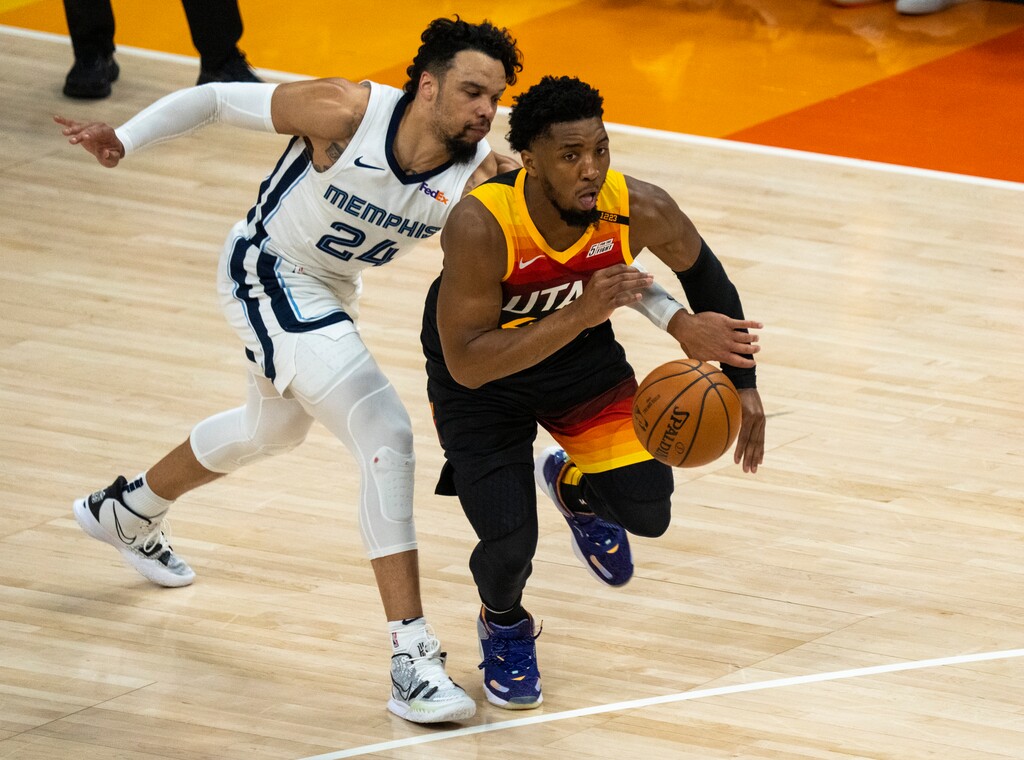 (Rick Egan | The Salt Lake Tribune) Memphis Grizzlies forward Dillon Brooks (24) reaches through to try to steal the ball, as Utah guard Donovan Mitchell (45) goes on to score for the Jazz, in game 2 of NBA Playoffs at Vivint Arena, on Wednesday, May 26, 2021.