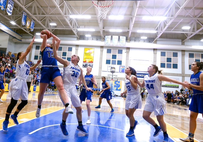 (Leah Hogsten  |  The Salt Lake Tribune) Bingham's Maggie McCord (15) fights for the shot under the defense of Fremont's Abby Broadbent (12) and Fremont's Berkley Larsen (30). Bingham faces Fremont in the championship game of the 6A High School Girls' Basketball Tournament at SLCC in Taylorsville,Saturday, Feb. 24, 2018. 