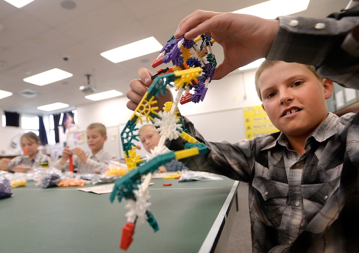 (Al Hartmann | The Salt Lake Tribune) Sixth grader Rylee Spackman finishes building a simple machine hand drill at Park Valley School Wednesday August 30.