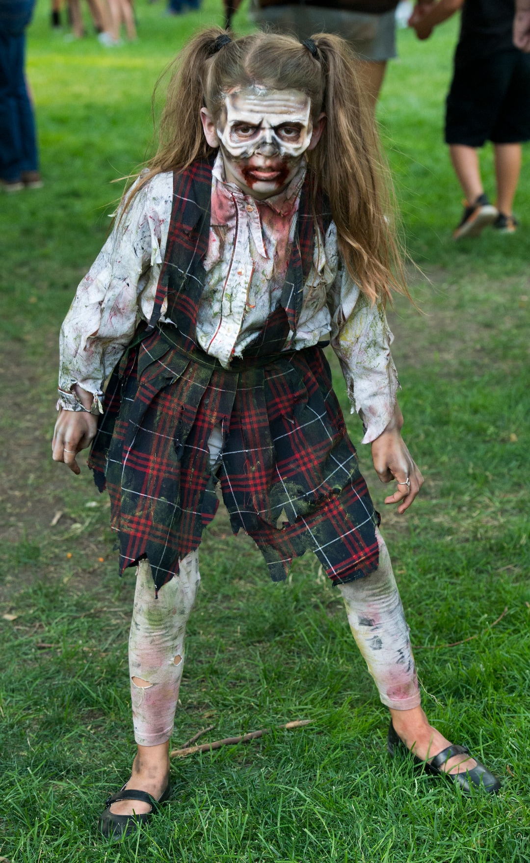    (Rick Egan  |  The Salt Lake Tribune)       Ivy Bryan, 9, scares the locals as she dresses as a zombie in Salt Lake during the 11th annual Salt Lake Zombie Walk, Sunday, Aug. 26, 2018.