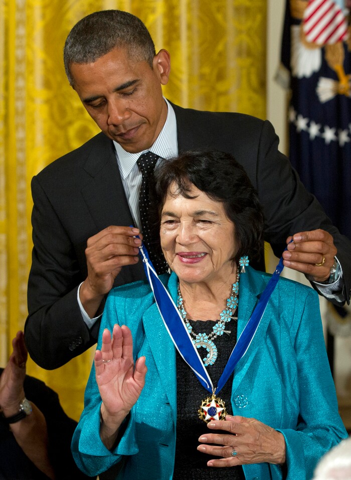 FILE - In this May 29, 2012, file photo, President Barack Obama awards American labor leader and civil rights activist Dolores Clara Fernandez Huerta the Presidential Medal of Freedom, during a ceremony in the East Room of the White House in Washington. Huerta, the social activist who formed a farm workers union with César Chávez and whose "Si, Se Puede" chant inspired Barack Obama's 2008 presidential campaign slogan, is the subject of a new PBS documentary. The film "Dolores" examines the life of the New Mexico-born Mexican-American reformer from her time as a tireless United Farm Workers leader and a campaign volunteer for Sen. Robert Kennedy's 1968 presidential run. (AP Photo/Carolyn Kaster, File)