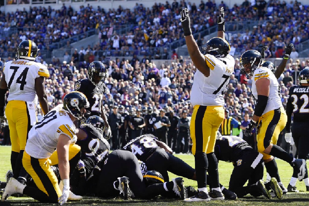 Gail Burton | The Associated Press. Pittsburgh Steelers offensive guard Ramon Foster (73) celebrates running back Le'Veon Bell's (26) touchdown during the first half of an NFL football game against the Baltimore Ravens in Baltimore, Sunday, Oct. 1, 2017.